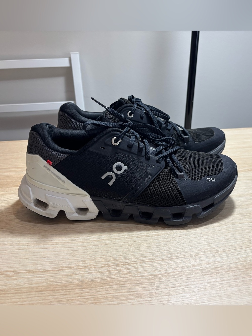 On Cloudflow Women's Athletic Running Shoes in Black with White Heel